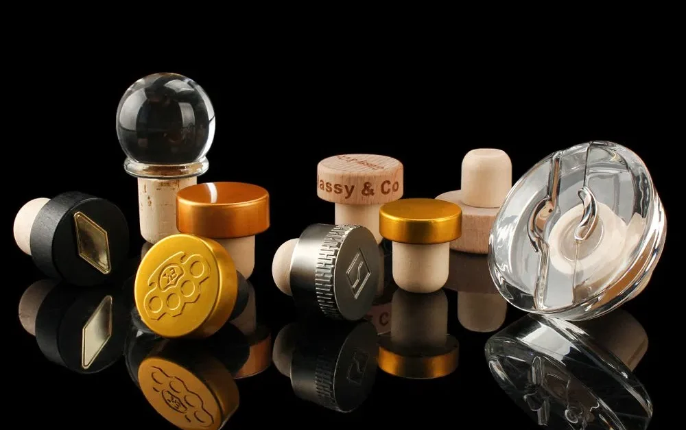 Compare bar-top stopper sizes, materials, stock vs custom options, fit testing, supplier checks, and RFQ steps for spirits packaging projects.