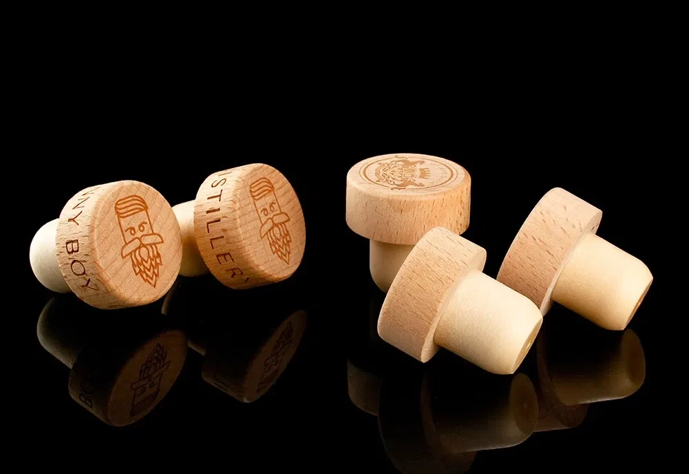 Compare hot foil logo bar-top stoppers for spirits bottles, including materials, artwork, neck fit, quality checks, samples, and RFQ tips.